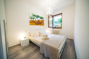 A bed or beds in a room at ULIVI Beth's House