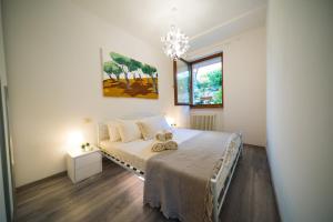 A bed or beds in a room at ULIVI Beth's House