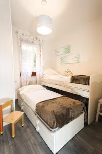 A bed or beds in a room at ULIVI Beth's House