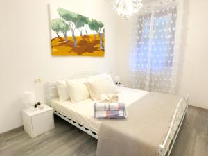 A bed or beds in a room at ULIVI Beth's House