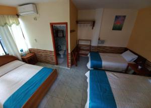 Postel nebo postele na pokoji v ubytování HOSTAL JANET STARLiNK