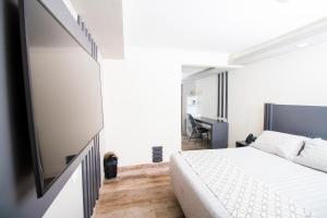 Postel nebo postele na pokoji v ubytování Hotel Sirari By Regina