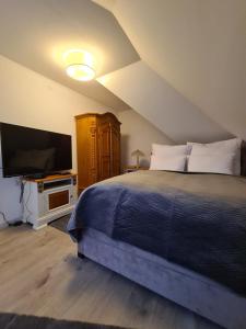 מיטה או מיטות בחדר ב-Sonnenhof Bad Salzuflen