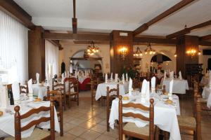 Reštaurácia alebo iné gastronomické zariadenie v ubytovaní Olympic Turismo Antico Borgo Hotel