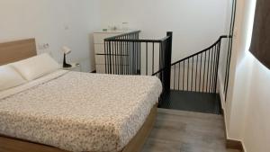 Posteľ alebo postele v izbe v ubytovaní Apartamento en el casco antiguo en plena Alameda