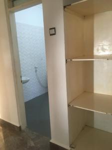 a walk in closet with a glass door at Tayana place in Kizimkazi