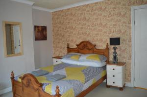 Ένα ή περισσότερα κρεβάτια σε δωμάτιο στο The Crandale House Vacation Home