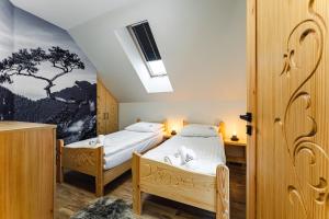 Posteľ alebo postele v izbe v ubytovaní Apartament Między Górami