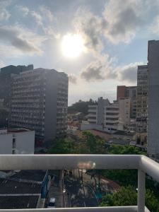a view of a city with the sun in the sky at Oscar Hotel in Florianópolis
