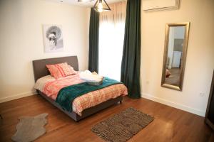 Postel nebo postele na pokoji v ubytování Aria Apartmani