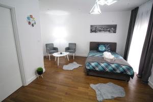 Postel nebo postele na pokoji v ubytování Aria Apartmani