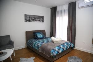 Postel nebo postele na pokoji v ubytování Aria Apartmani
