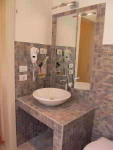 a bathroom with a sink and a mirror at B&B RELAX in Rome