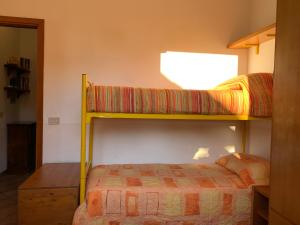 En eller flere senge i et værelse på La Finestra su Mothia