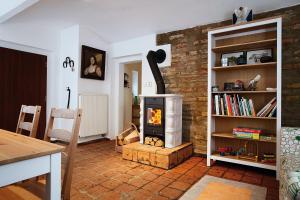 a living room with a wood burning stove in it at Statek Keblice in Keblice