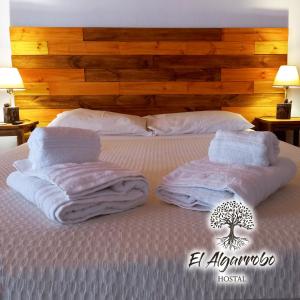 Ένα ή περισσότερα κρεβάτια σε δωμάτιο στο Hostal El Algarrobo