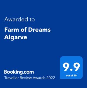 a blue sign with the text awarded to farm of dreams almanac at Farm of Dreams Algarve in Almancil