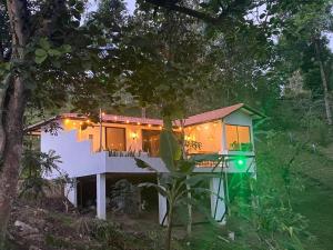 a house with lights on the side of it at Reserva de Gomalu in San Francisco