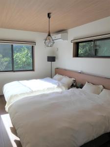 Postel nebo postele na pokoji v ubytování 山里の家