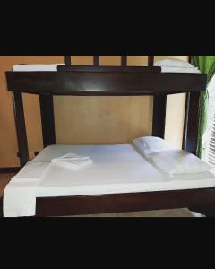 Voodi või voodid majutusasutuse Cabinas surf Arribadas toas