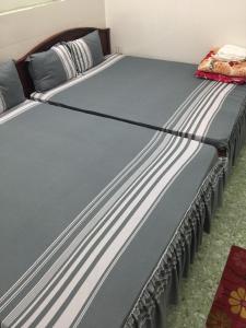 Postel nebo postele na pokoji v ubytování Minh Hiền Hotel