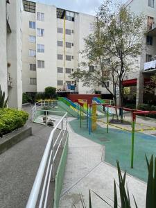 a park with a playground in a city at Bogotá hermoso departamento en CDMX in Mexico City
