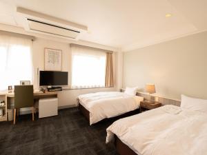 Postel nebo postele na pokoji v ubytování Hotel Iidaya + 37 fotografií