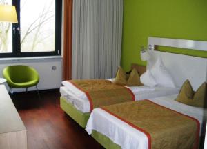 Katil atau katil-katil dalam bilik di Hotel Ullrich