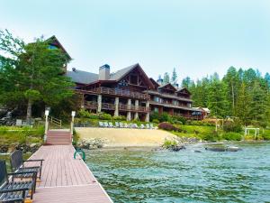 a large house on the shore of a river at Lodge at Sandpoint in Sandpoint