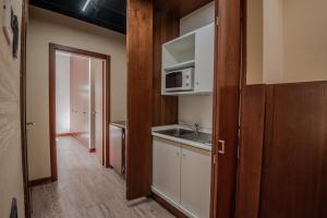 Kuchyň nebo kuchyňský kout v ubytování Hotel Petra