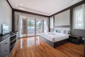 Postel nebo postele na pokoji v ubytování RimLay Beachfront Pool Villa + 37 fotografií