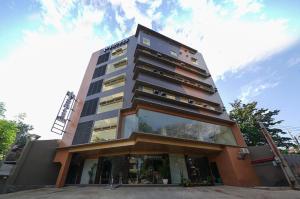 a tall building with a lot of windows at FB Dormitel Suites in Cagayan de Oro