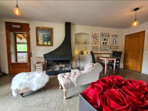 a living room with a couch and a fireplace at Harveys Homestay - Adults only in Mieres +46 photos