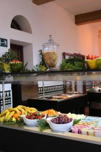 
a kitchen filled with lots of different types of food at Beverly Hills Suites - Excel Hotels & Resorts in Los Cristianos
