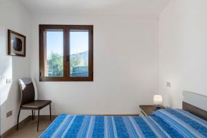 Postel nebo postele na pokoji v ubytování Casa Museddu