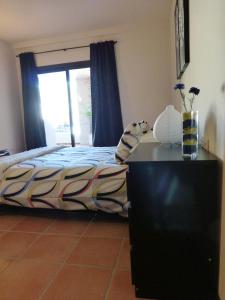 Posteľ alebo postele v izbe v ubytovaní El Casar Apartments