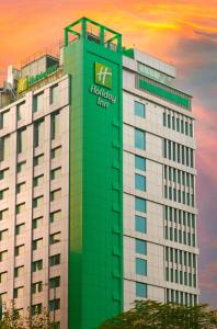 a building with a sign on the side of it at Holiday Inn Dhaka City Centre, an IHG Hotel in Dhaka