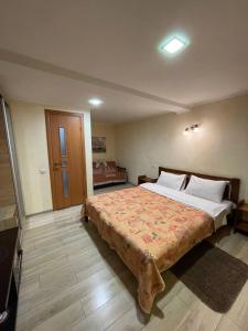 Апартаменты SunRiseにあるベッド