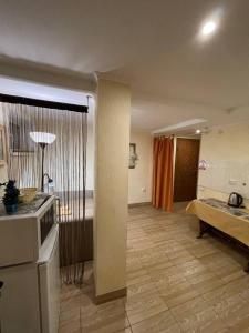 Апартаменты SunRiseにあるベッド