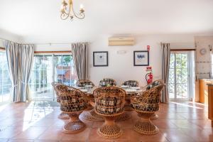 a dining room with a table and chairs at Villa Goshen in Lagos
