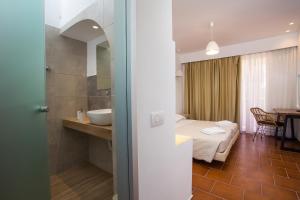 Posteľ alebo postele v izbe v ubytovaní Muses Hotel