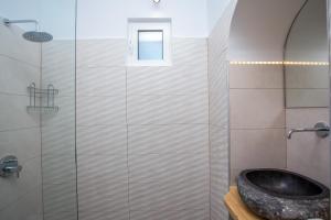 Kúpeľňa v ubytovaní Muses Hotel