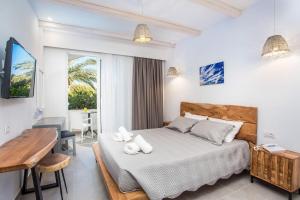 Posteľ alebo postele v izbe v ubytovaní Muses Hotel