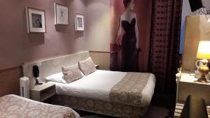 Letto o letti in una camera di Hotel Mignon