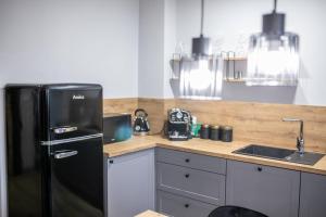 Kuchyňa alebo kuchynka v ubytovaní Loft 33