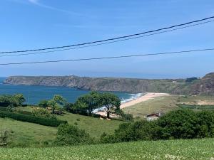 a view of the ocean and a beach at Casa Lin Nieva in Nieva