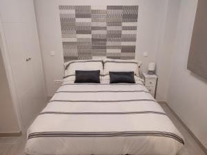 Voodi või voodid majutusasutuse Apartamento Madrid Norte toas