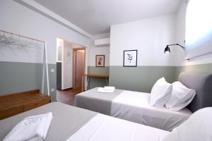 Кровать или кровати в номере AG Luxury Villas, Iraklitsa