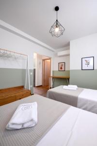 Кровать или кровати в номере AG Luxury Villas, Iraklitsa