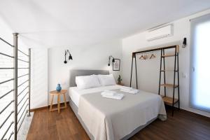 Кровать или кровати в номере AG Luxury Villas, Iraklitsa